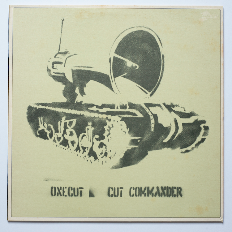 One Cut Records ‘Commander’. Design Phil@Azlan, artwork by Banksy, 1998